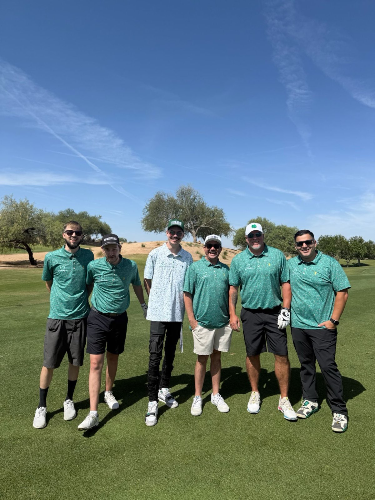 A sponsored foursome on course at the Arizona Golf Classic